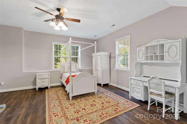 bedroom with visible vents, baseboards, a ceiling fan, dark wood-style flooring, and vaulted ceiling