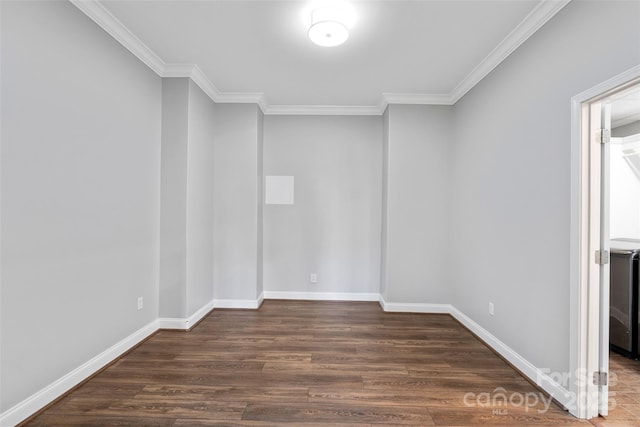 unfurnished room with crown molding, baseboards, and wood finished floors