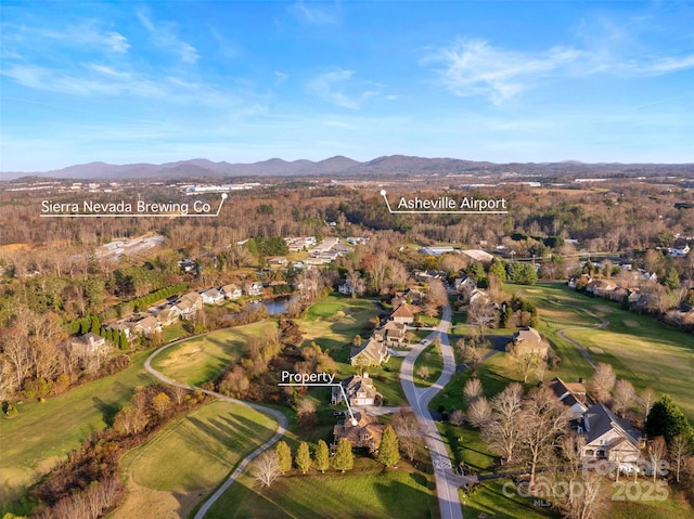 birds eye view of property with a mountain view and golf course view