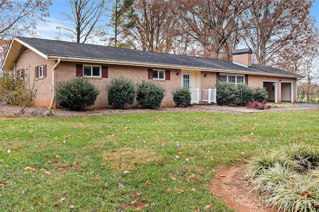 ranch-style home featuring a front yard