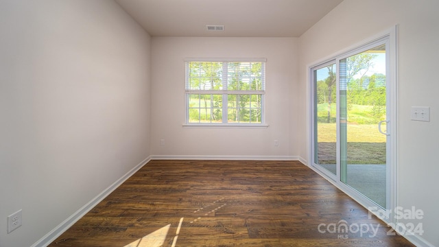 empty room featuring dark hardwood / wood-style floors