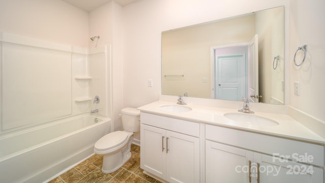 full bathroom with toilet, vanity, and tub / shower combination