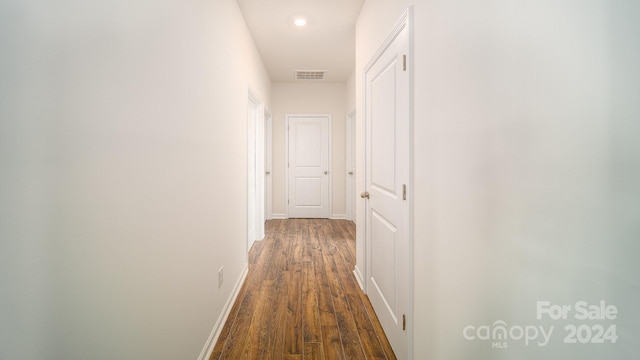 hallway featuring dark hardwood / wood-style floors