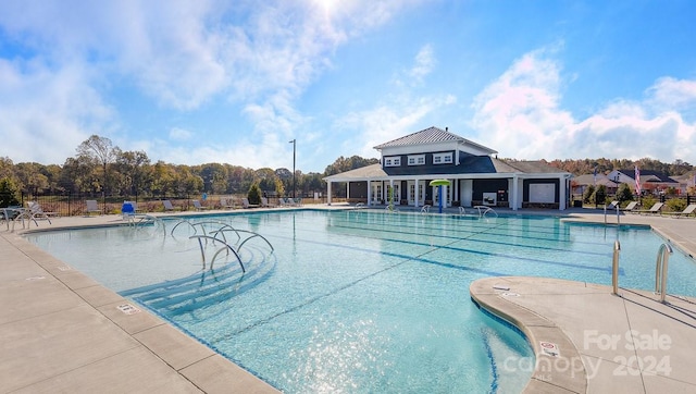 view of swimming pool with a patio