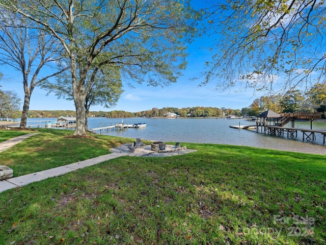 dock area featuring a yard and a water view