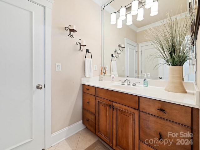 bathroom with vanity, tile patterned floors, and ornamental molding