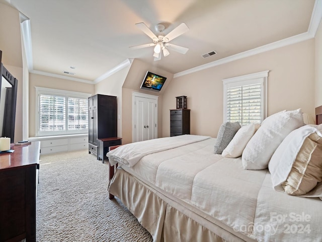 carpeted bedroom featuring multiple windows, ceiling fan, and crown molding