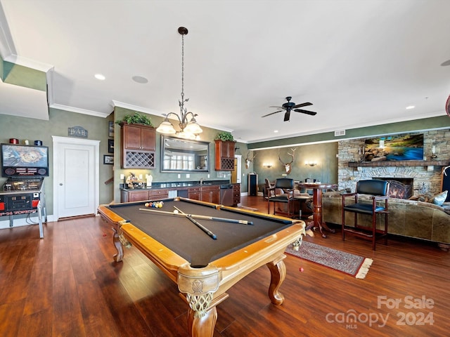 playroom featuring dark hardwood / wood-style flooring, ceiling fan, crown molding, billiards, and a fireplace