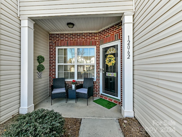 doorway to property with a porch