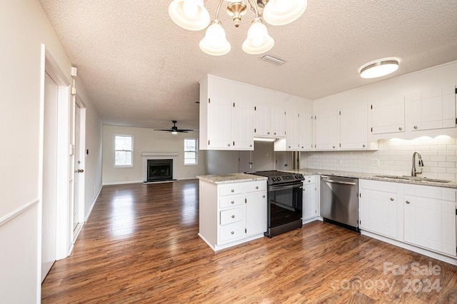 kitchen with dark wood-type flooring, black range with electric stovetop, sink, hanging light fixtures, and stainless steel dishwasher