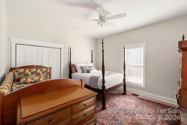 bedroom with ceiling fan and a closet