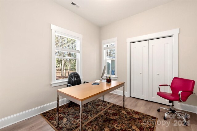 office with hardwood / wood-style flooring