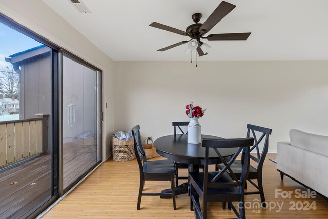 dining area featuring ceiling fan and light hardwood / wood-style flooring