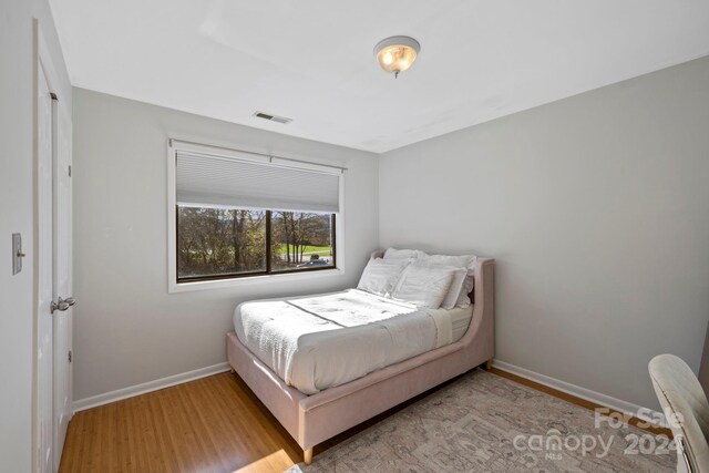 bedroom with light hardwood / wood-style flooring