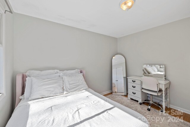 bedroom with light hardwood / wood-style floors