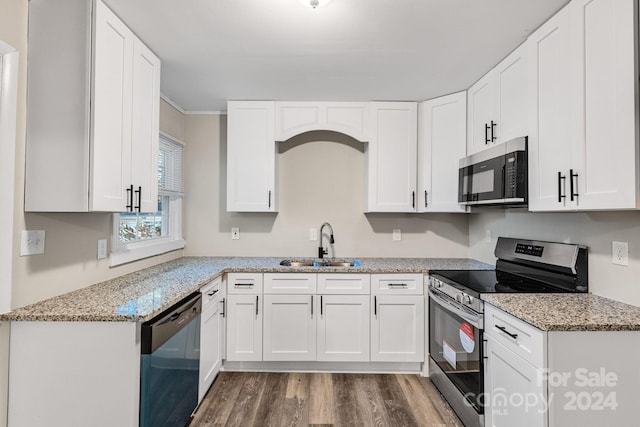 kitchen with sink, white cabinetry, and stainless steel appliances