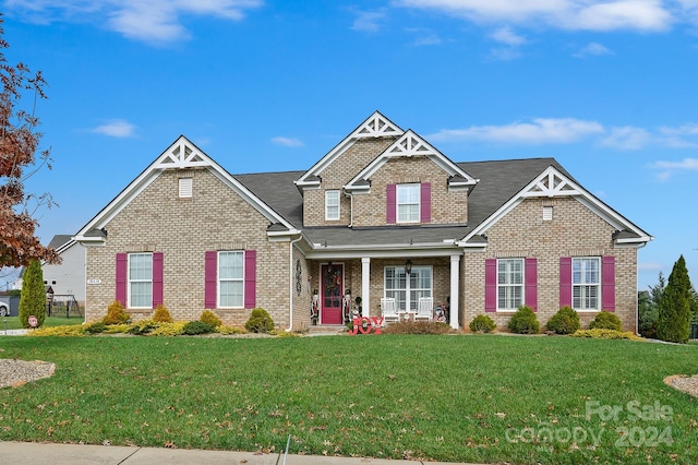 craftsman-style house with a front yard