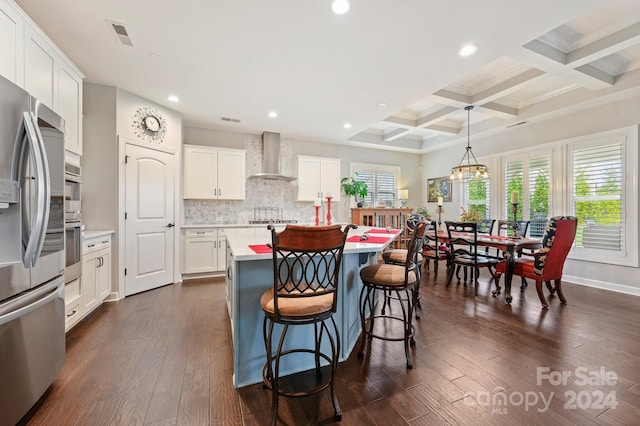 kitchen with a center island with sink, wall chimney exhaust hood, white cabinets, and dark wood-type flooring