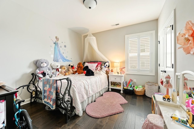 bedroom featuring dark wood-type flooring