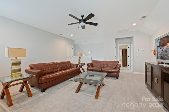 carpeted living room with vaulted ceiling and ceiling fan