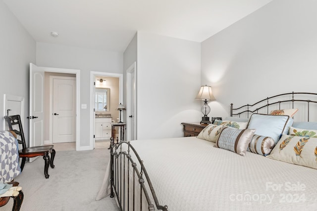 carpeted bedroom with ensuite bath