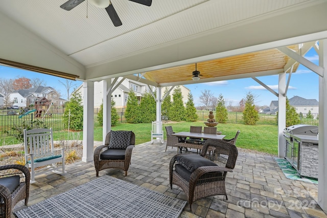 view of patio featuring ceiling fan and a grill