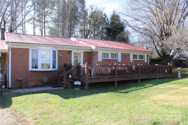 back of house with a yard and a deck