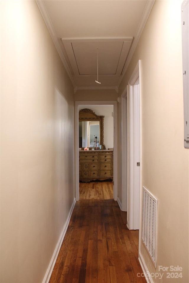 hallway with crown molding and dark hardwood / wood-style floors