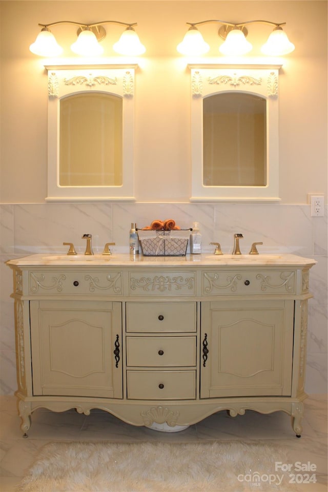 bathroom featuring vanity and tile walls