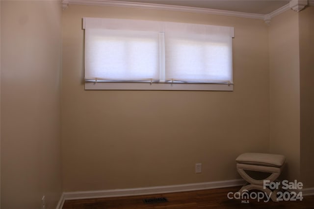 unfurnished room featuring crown molding and dark hardwood / wood-style floors