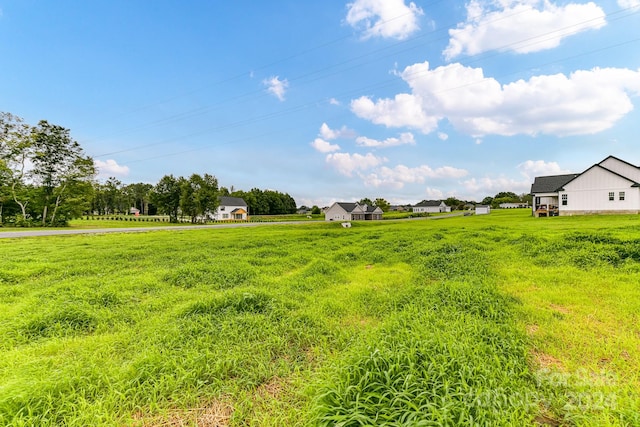 view of yard with a rural view