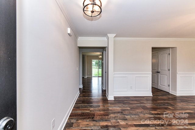 hallway featuring dark hardwood / wood-style floors and ornamental molding