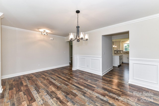 unfurnished dining area featuring crown molding, dark wood-type flooring, and a notable chandelier