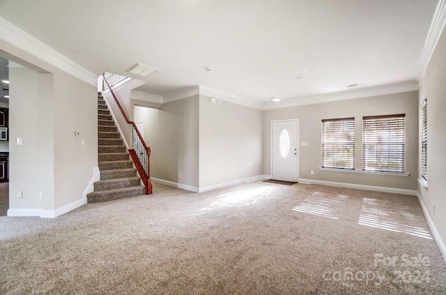 unfurnished living room with carpet flooring and crown molding