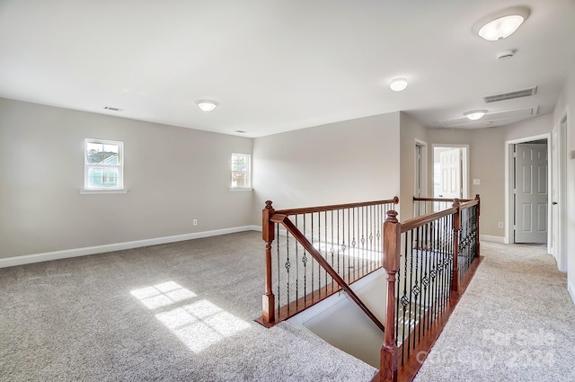 hallway with light carpet