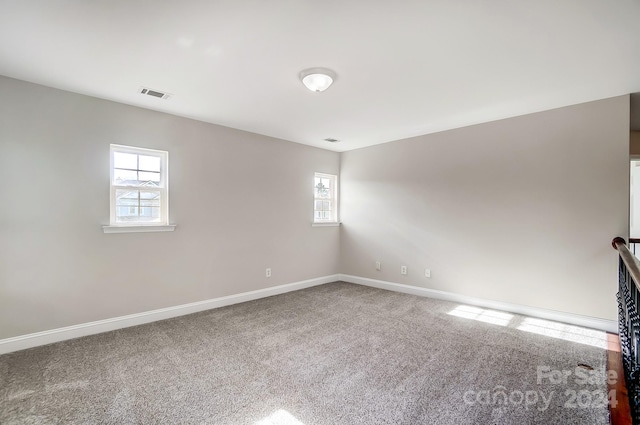 unfurnished room featuring carpet