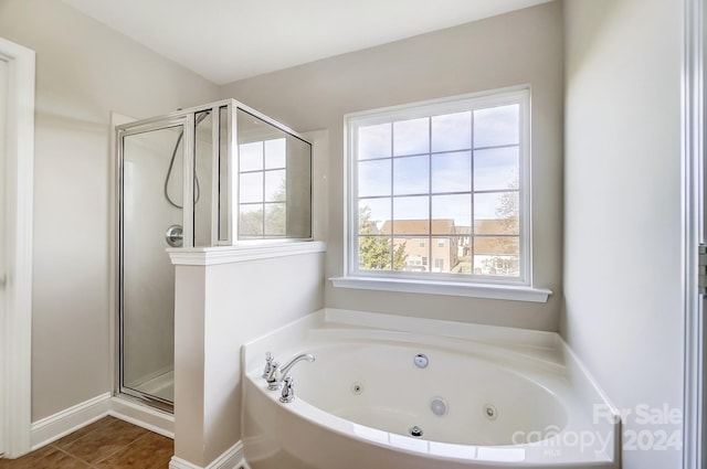 bathroom with tile patterned flooring and plus walk in shower