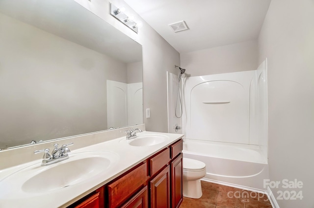 full bathroom featuring vanity,  shower combination, tile patterned floors, and toilet