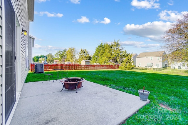 view of patio / terrace with a fire pit and central air condition unit