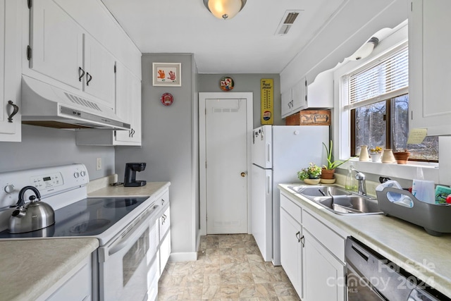 kitchen featuring white appliances, white cabinetry, and sink