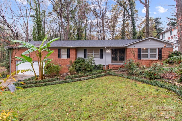 single story home with a garage and a front lawn