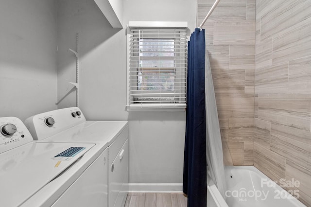 laundry room with washing machine and clothes dryer