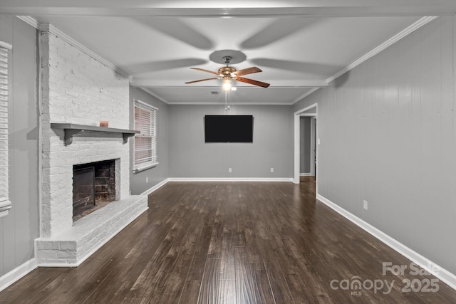 unfurnished living room with ceiling fan, a brick fireplace, dark hardwood / wood-style flooring, and crown molding