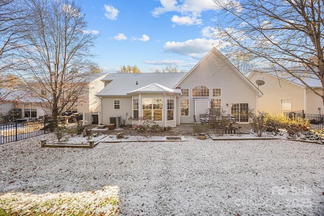 rear view of property featuring a patio area and cooling unit