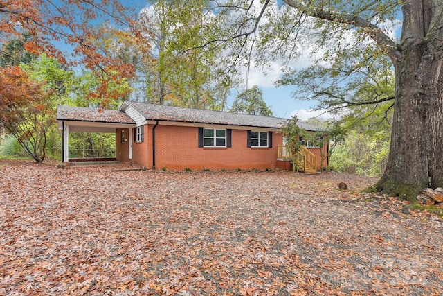 view of property exterior with a carport