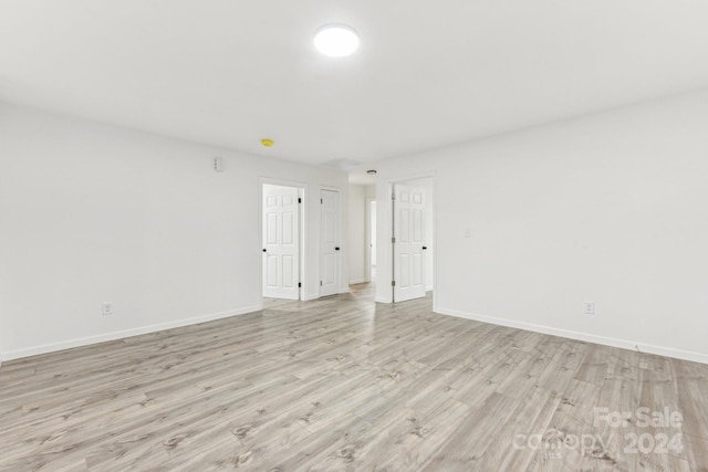 spare room with light hardwood / wood-style floors