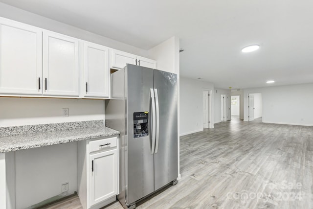 kitchen featuring white cabinets, light hardwood / wood-style floors, and stainless steel fridge with ice dispenser