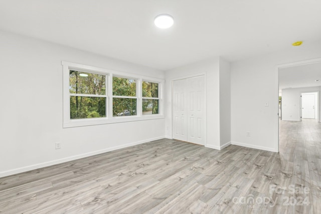 spare room featuring light hardwood / wood-style flooring