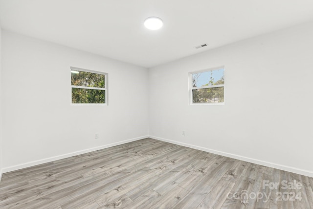 empty room with light wood-type flooring