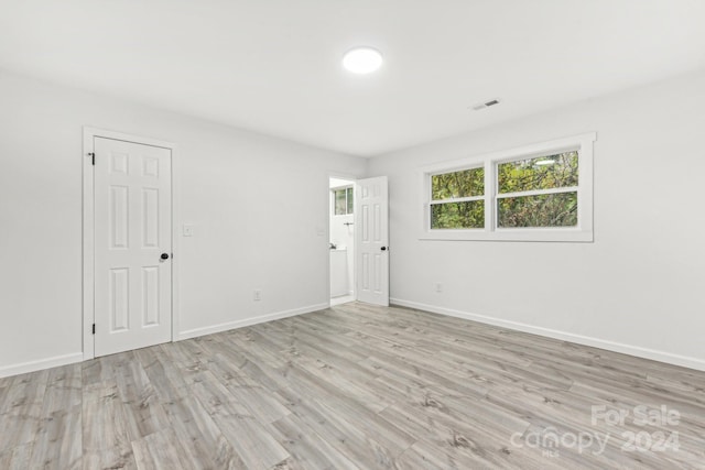 unfurnished room featuring light wood-type flooring